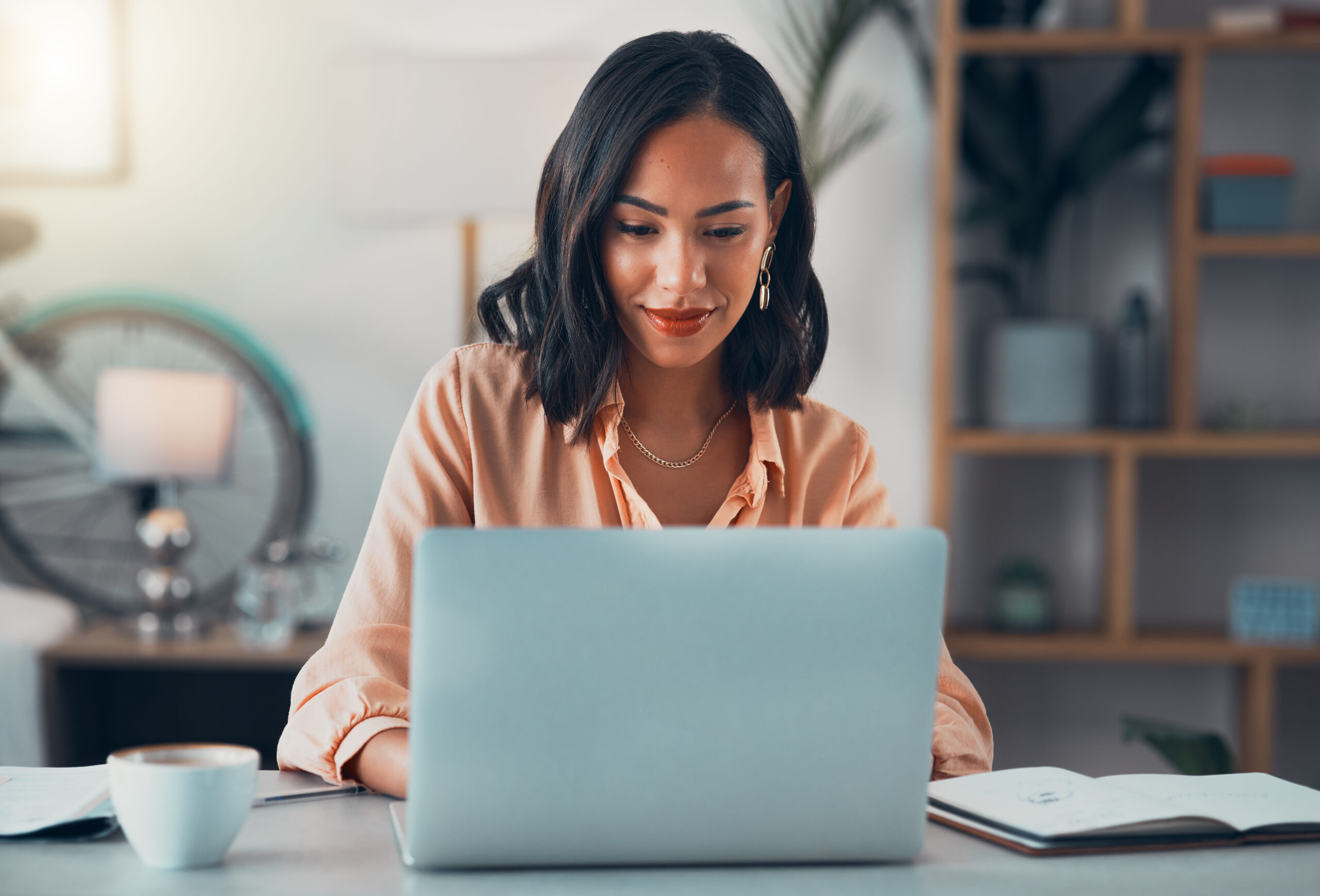 Woman looking at laptop